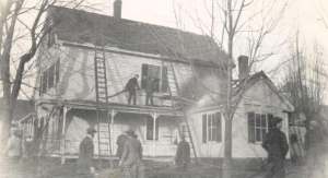 Hudson men battling  an active fire at the Bassett Home on Ferry Street - 1913